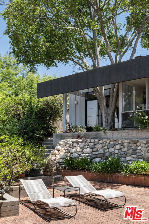 316 Redwood Drive Pasadena, CA 91105 - Photo 38 of 49 a front view of a house with garden