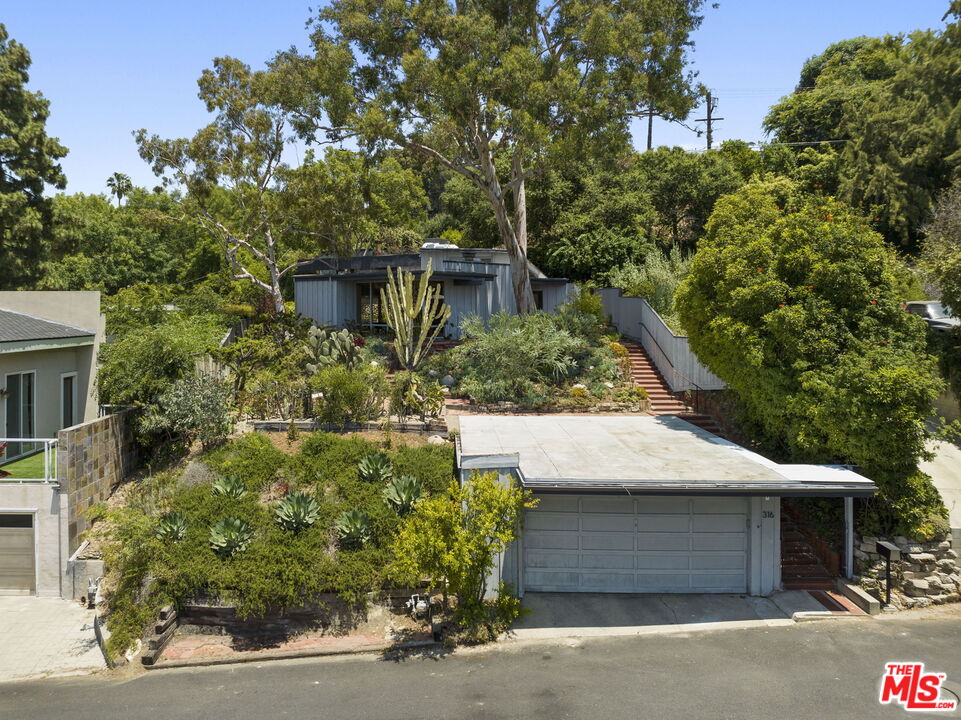 316 Redwood Drive Pasadena, CA 91105 - Photo 47 of 49 a front view of a house with a garden