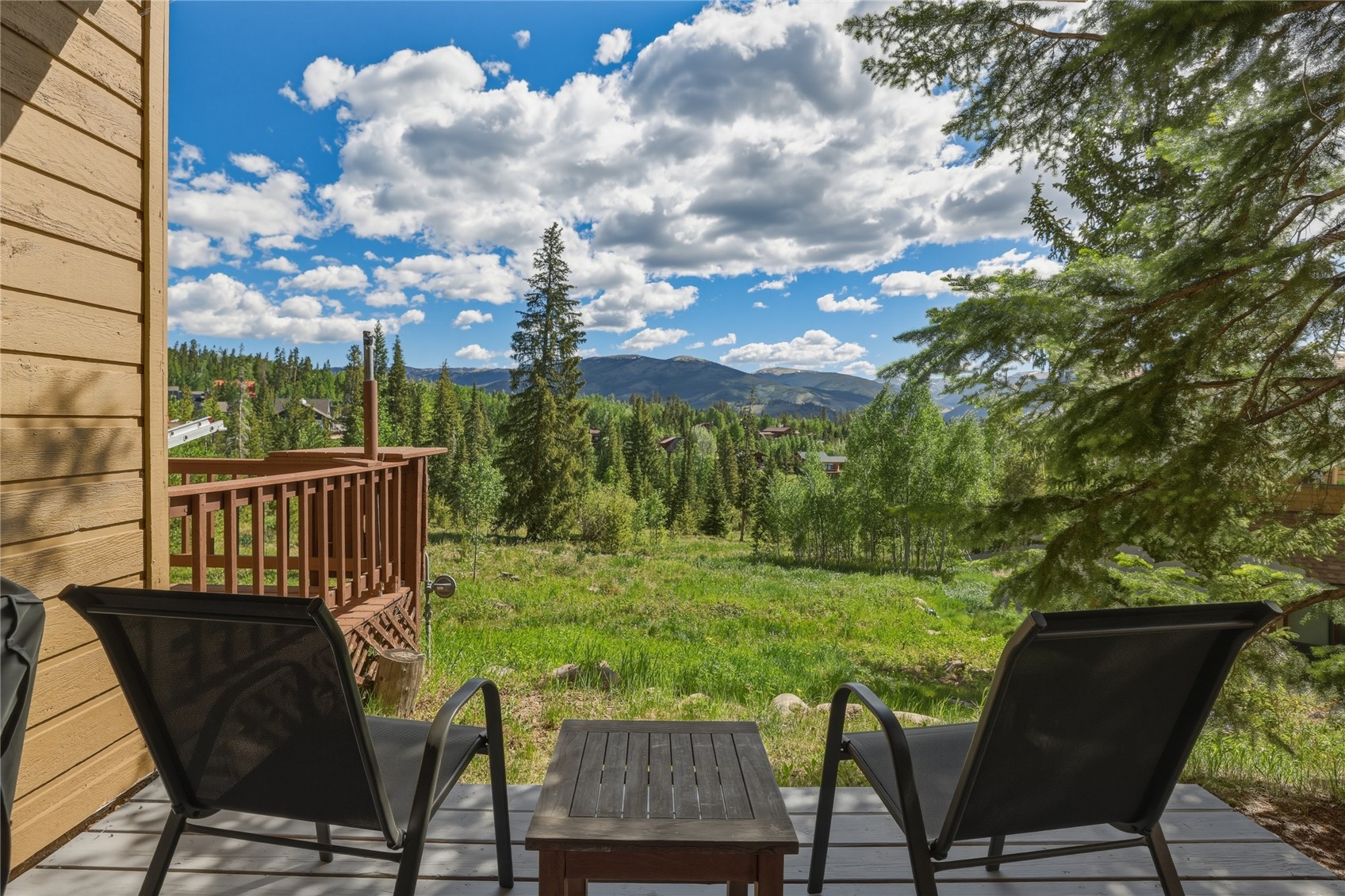 6726 Ryan Gulch Road, Unit 6726 Wildernest, CO 80498 - Photo 37 of 39 a view of a chairs and table in patio