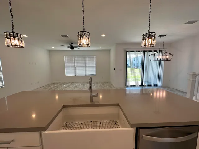 a bathroom with a sink shower and a mirror