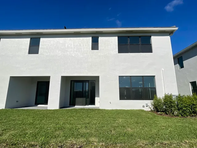 a view of a kitchen with a sink and microwave