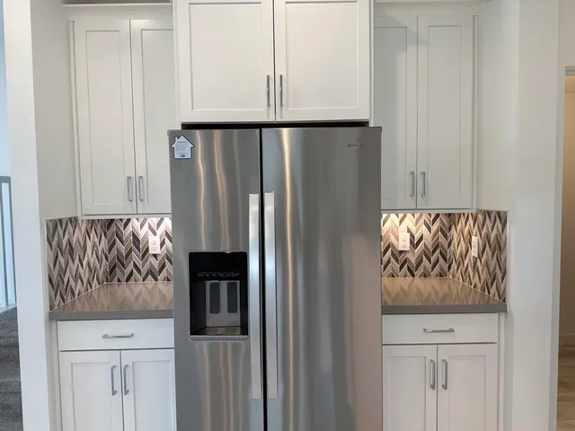 a kitchen with sink and window