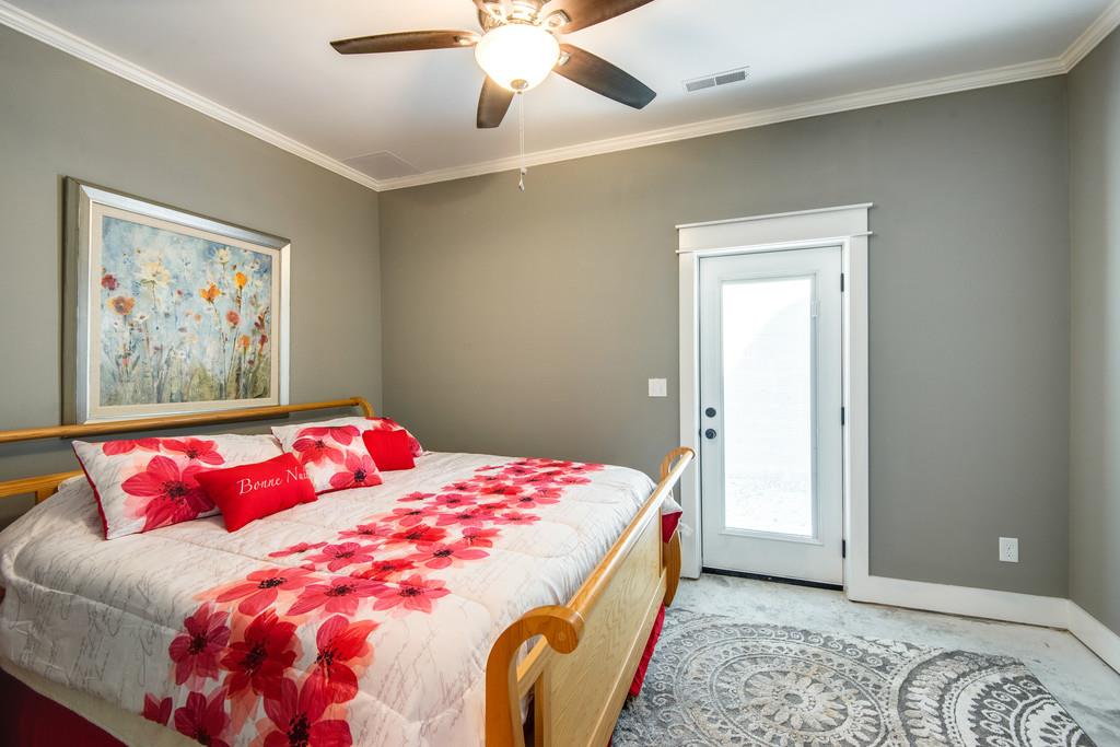 189 Wiley Branch Road Dickson, TN 37055 - Photo 21 of 30 a bedroom with a bed and a painting on the wall