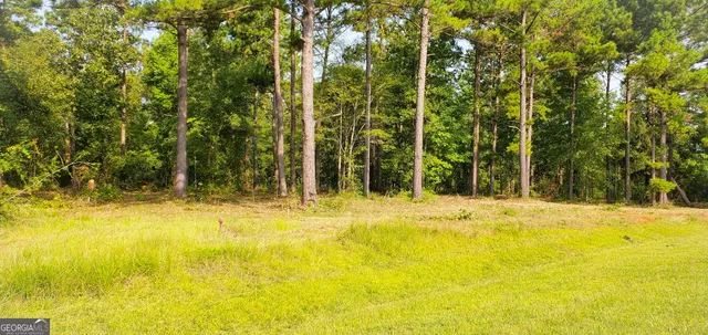 a view of a swimming pool with an outdoor space and seating area