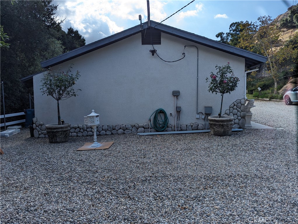 725 Box Canyon Road West Hills, CA 91304 - Photo 18 of 20 a front view of a house with garden