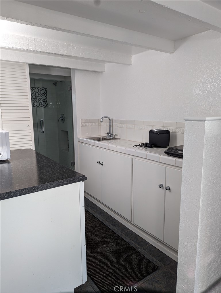 725 Box Canyon Road West Hills, CA 91304 - Photo 7 of 20 a kitchen with a sink and cabinets