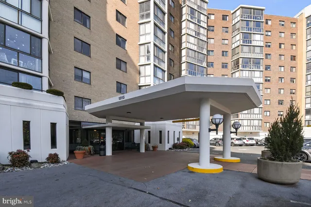 a view of a building with sitting area