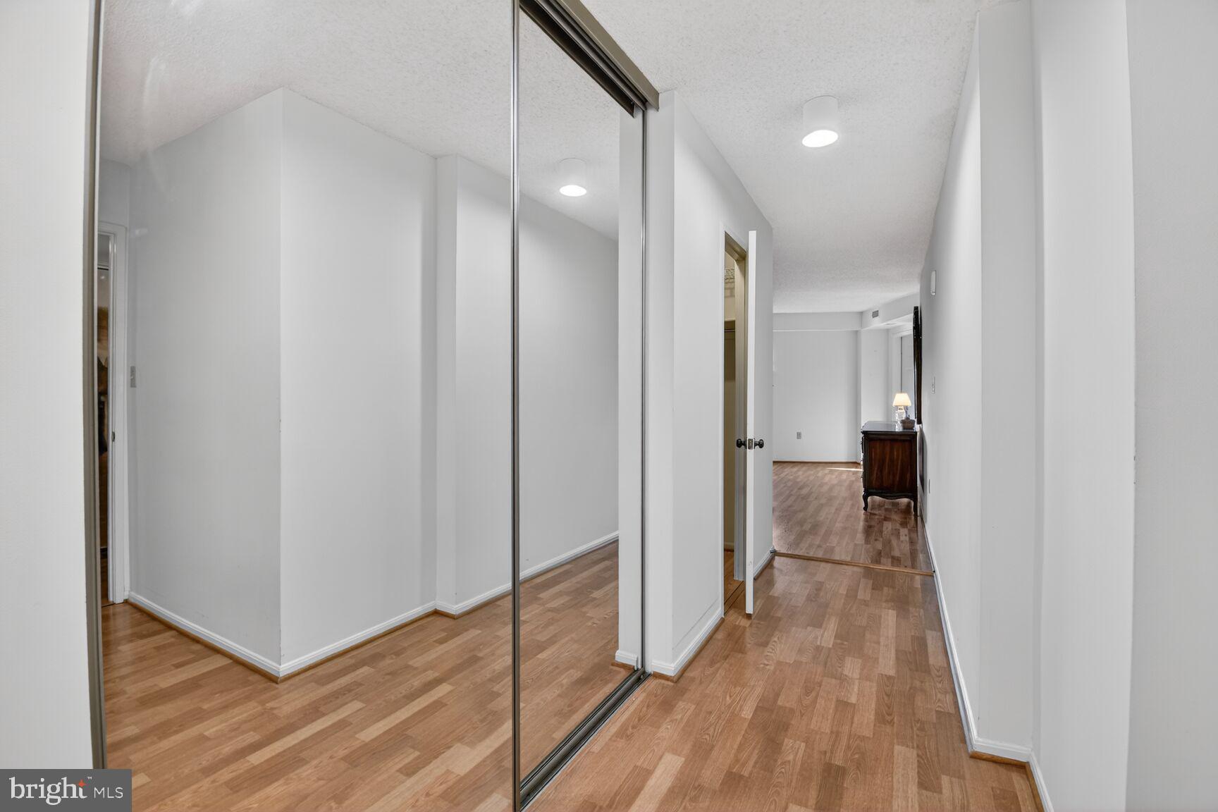 15115 Interlachen Drive, Unit 3904 Silver Spring, MD 20906 - Photo 25 of 43 a view of hallway with wooden floor