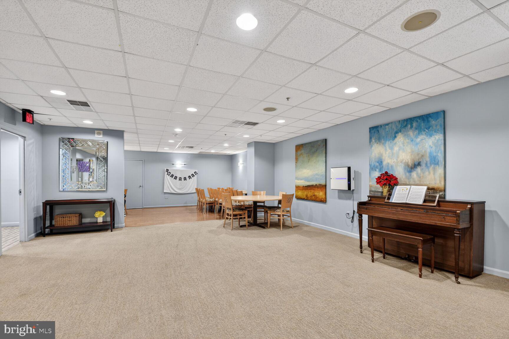 15115 Interlachen Drive, Unit 3904 Silver Spring, MD 20906 - Photo 28 of 43 a living room with furniture and a flat screen tv