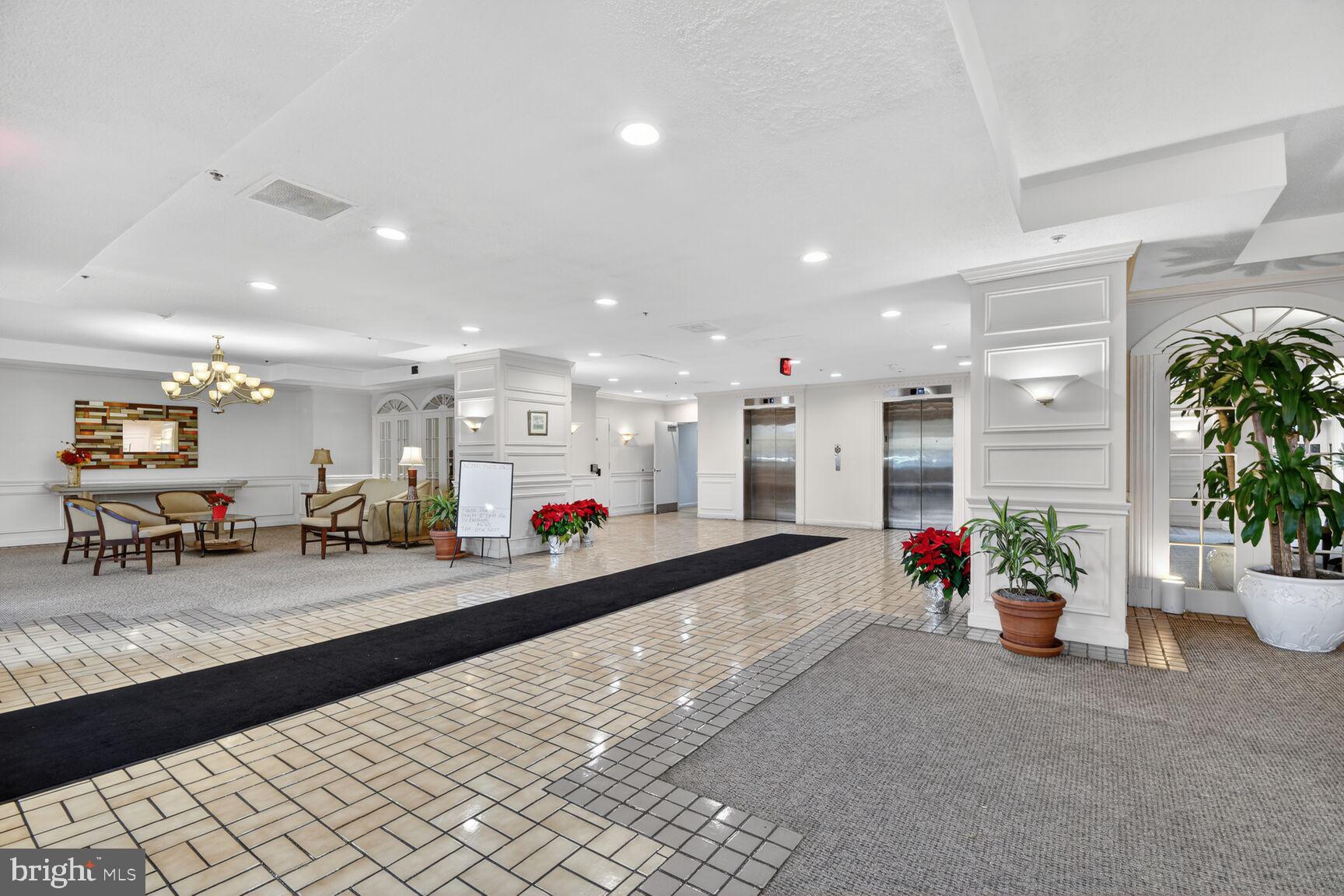 15115 Interlachen Drive, Unit 3904 Silver Spring, MD 20906 - Photo 29 of 43 a view of a room with gym equipment and potted plant