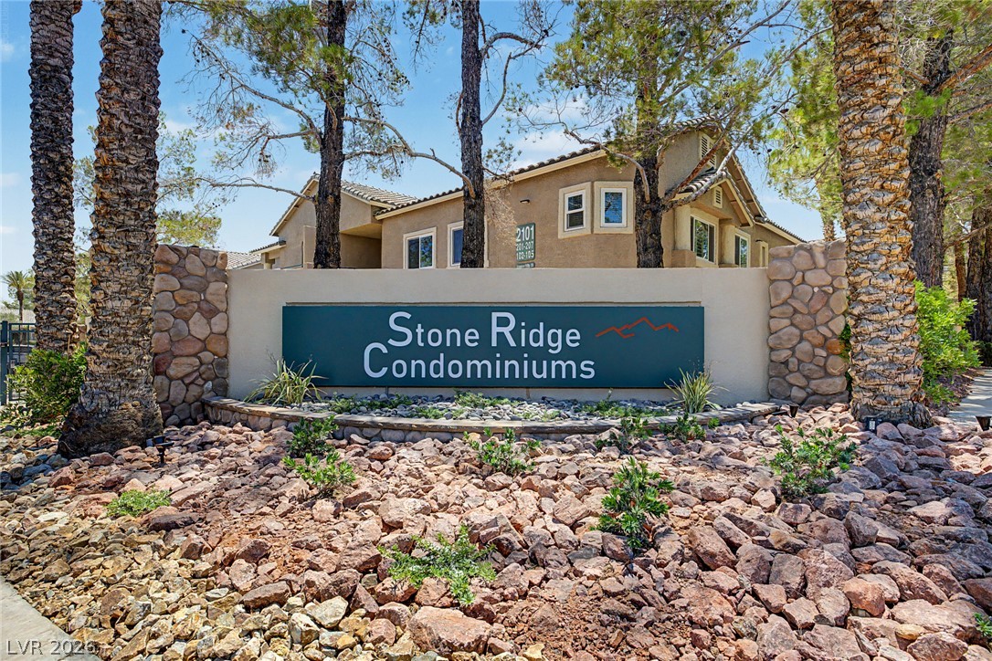 2153 Quarry Ridge Street, Unit 103 Las Vegas, NV 89117 - Photo 31 of 42 Welcoming stone facade and lush landscaping greet you at the entrance of this condominium community.