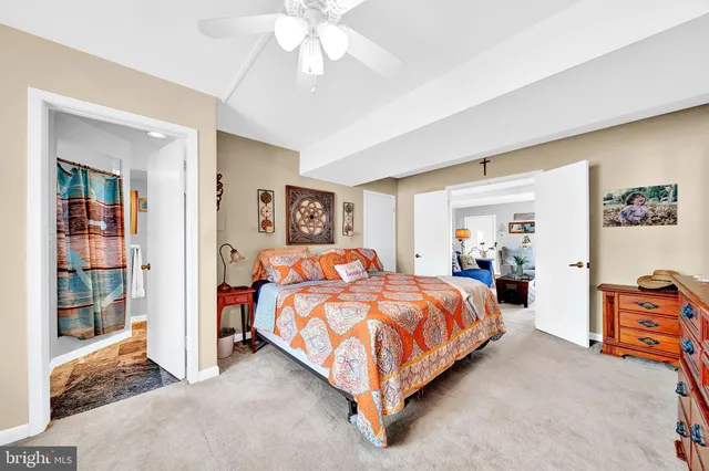 a bed room with a bed and a chandelier