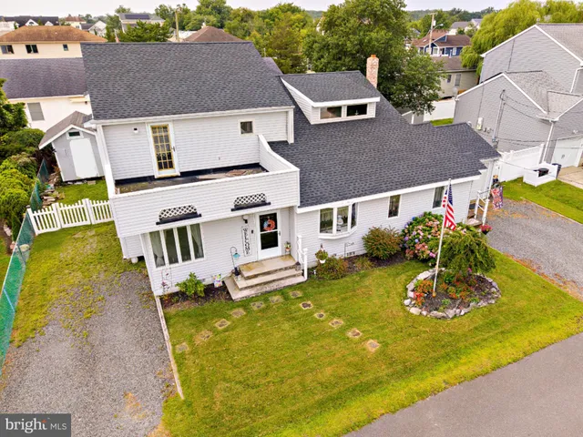 an aerial view of a house with swimming pool