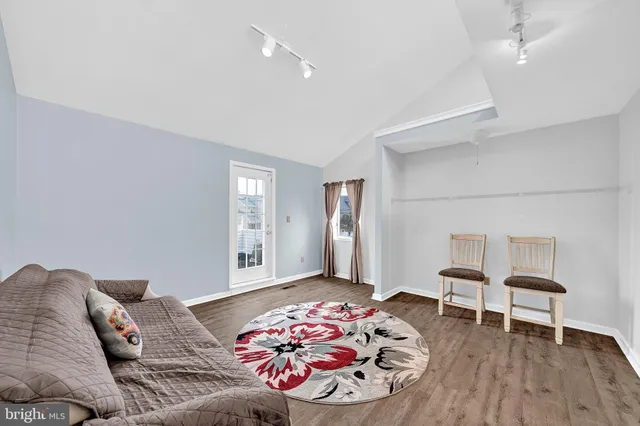 a bedroom with a bed and a chair