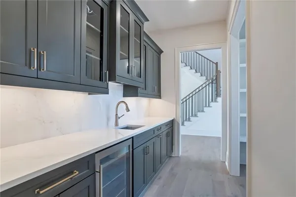 an empty room with windows and ceiling fan