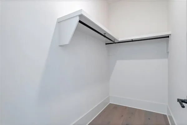 a view of an empty room with a fireplace