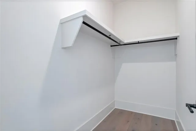 a view of an empty room with a fireplace