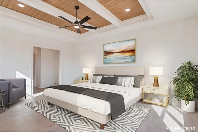a bathroom with a bathtub shower sink mirror vanity and toilet