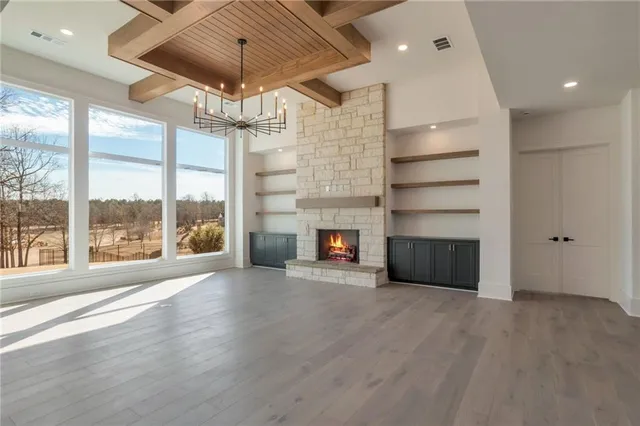 a view of an entryway with wooden floor and door