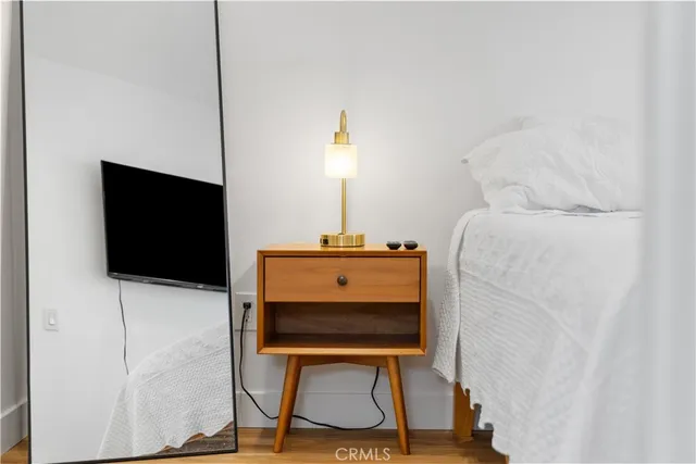 a room with a chair and a flat screen tv