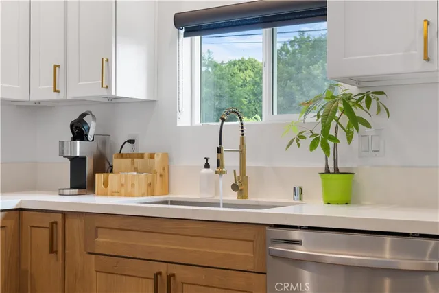 a kitchen with a sink and a window