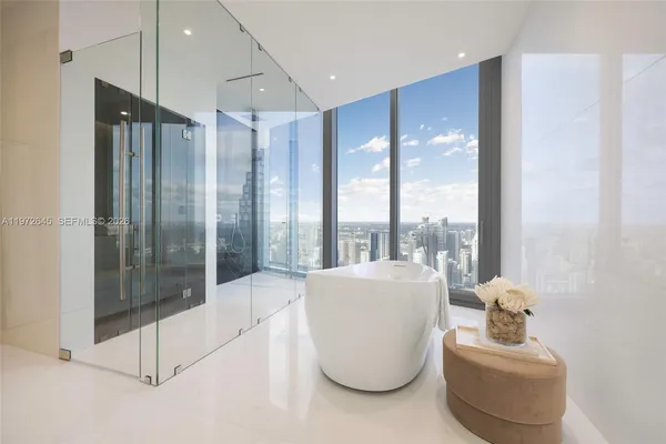 a bathroom with a bathtub and a sink