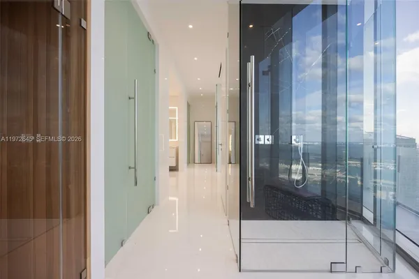 a bathroom with a glass shower door