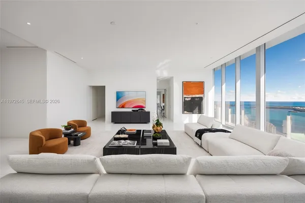 a room with furniture and a large window