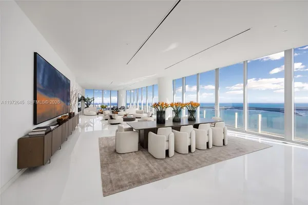a view of a dining room with furniture window and outside view