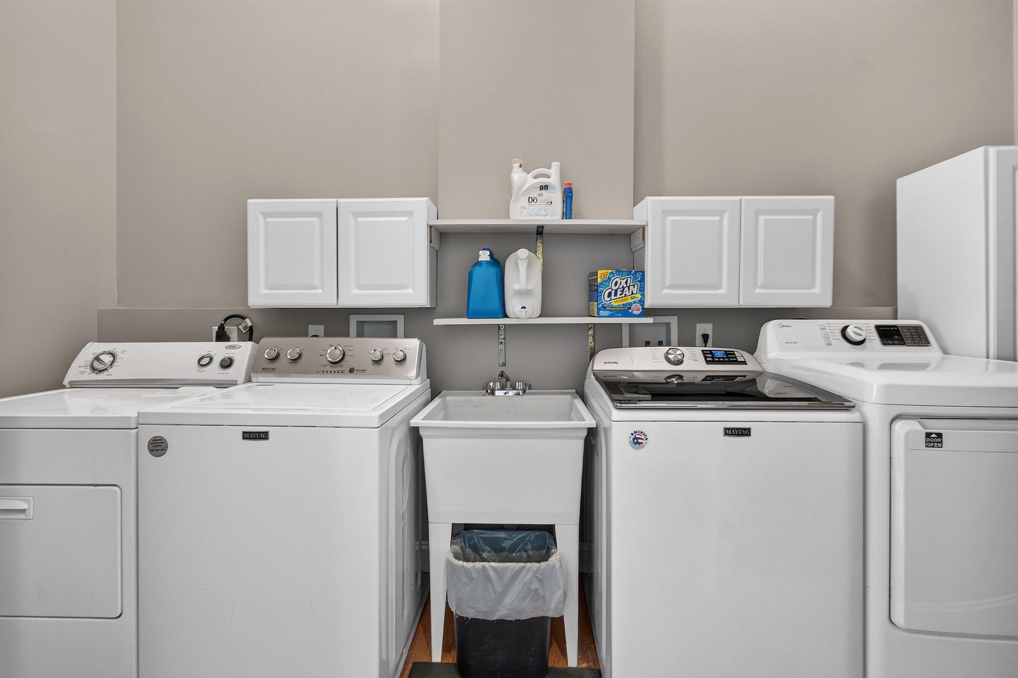 8406 New Cut Road Severn, MD 21144 - Photo 59 of 70 Main-level laundry room with 2 washers & 2 dryers