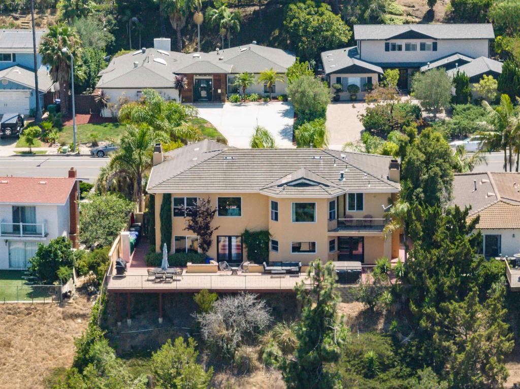 an aerial view of a house with swimming pool garden and patio