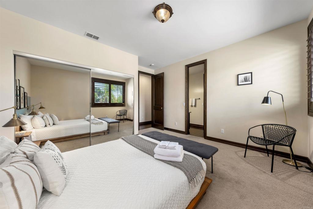 5765 Soledad Mountain Road La Jolla, CA 92037 - Photo 16 of 22 a bedroom with bed and window