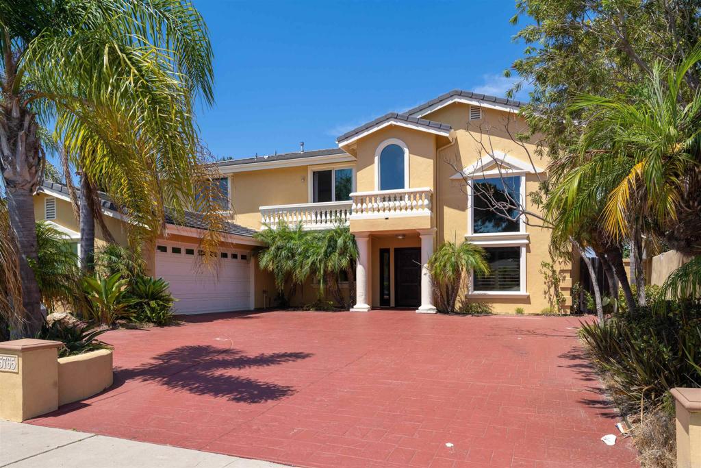 5765 Soledad Mountain Road La Jolla, CA 92037 - Photo 2 of 22 a front view of a house with a yard