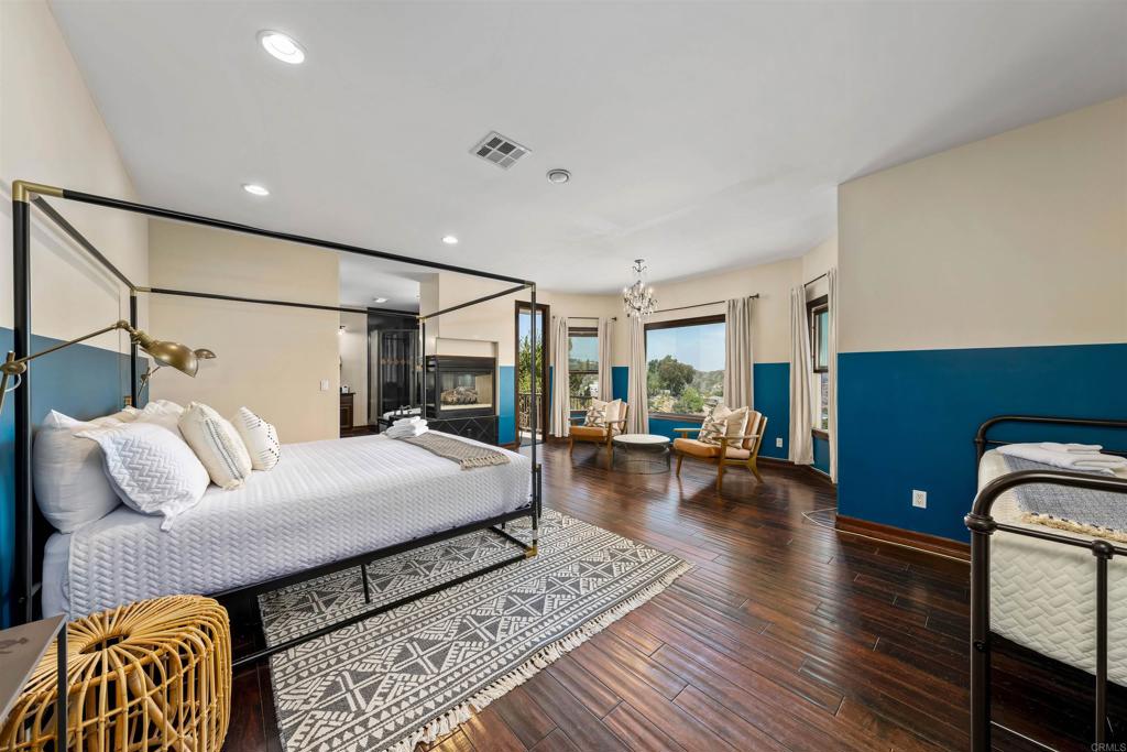 5765 Soledad Mountain Road La Jolla, CA 92037 - Photo 7 of 22 a bedroom with furniture and a couch