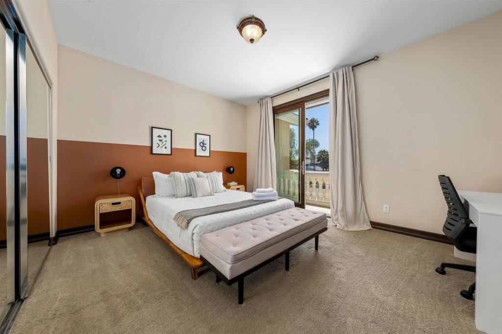 5765 Soledad Mountain Road La Jolla, CA 92037 - Photo 10 of 22 a spacious bedroom with a bed and a desk