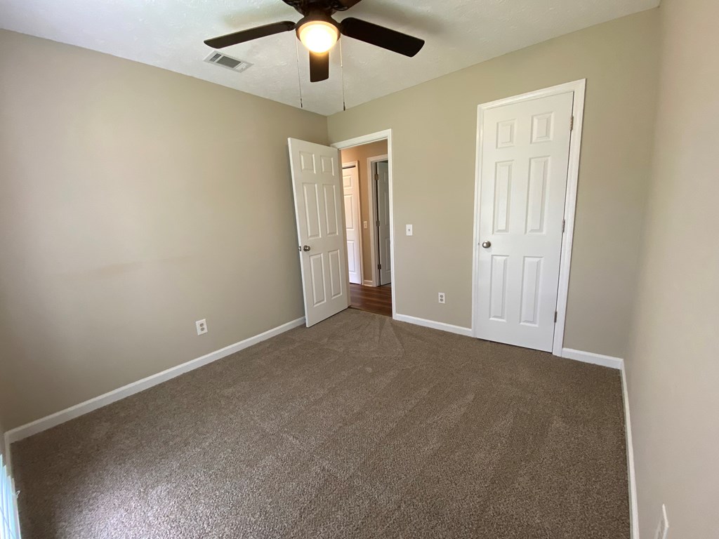 3 Deland Court Columbus, GA 31904 - Photo 17 of 27 an empty room with chandelier fan
