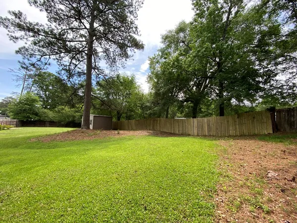 a swimming pool with wooden fence