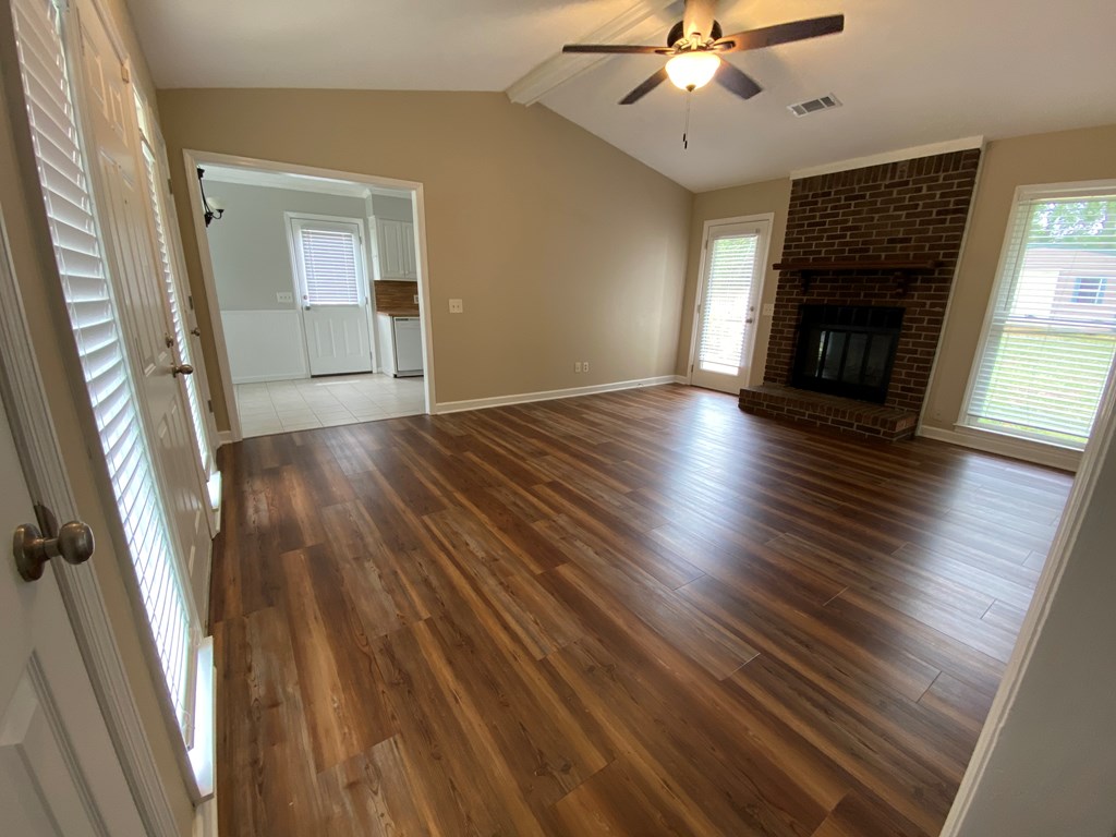 3 Deland Court Columbus, GA 31904 - Photo 8 of 27 wooden floor in an empty room with a fireplace