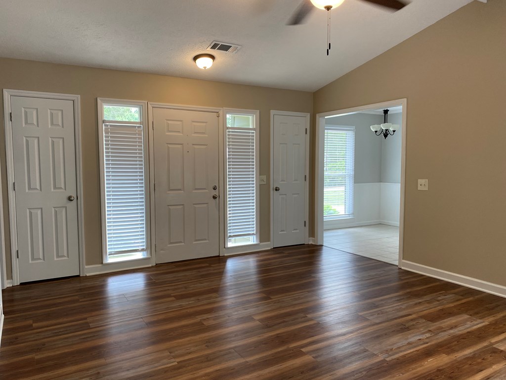 3 Deland Court Columbus, GA 31904 - Photo 10 of 27 an empty room with wooden floor and windows