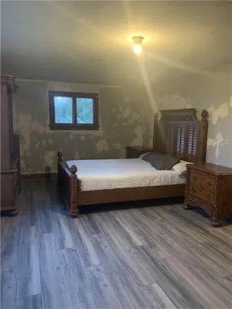 a living room with furniture rug and wooden floor