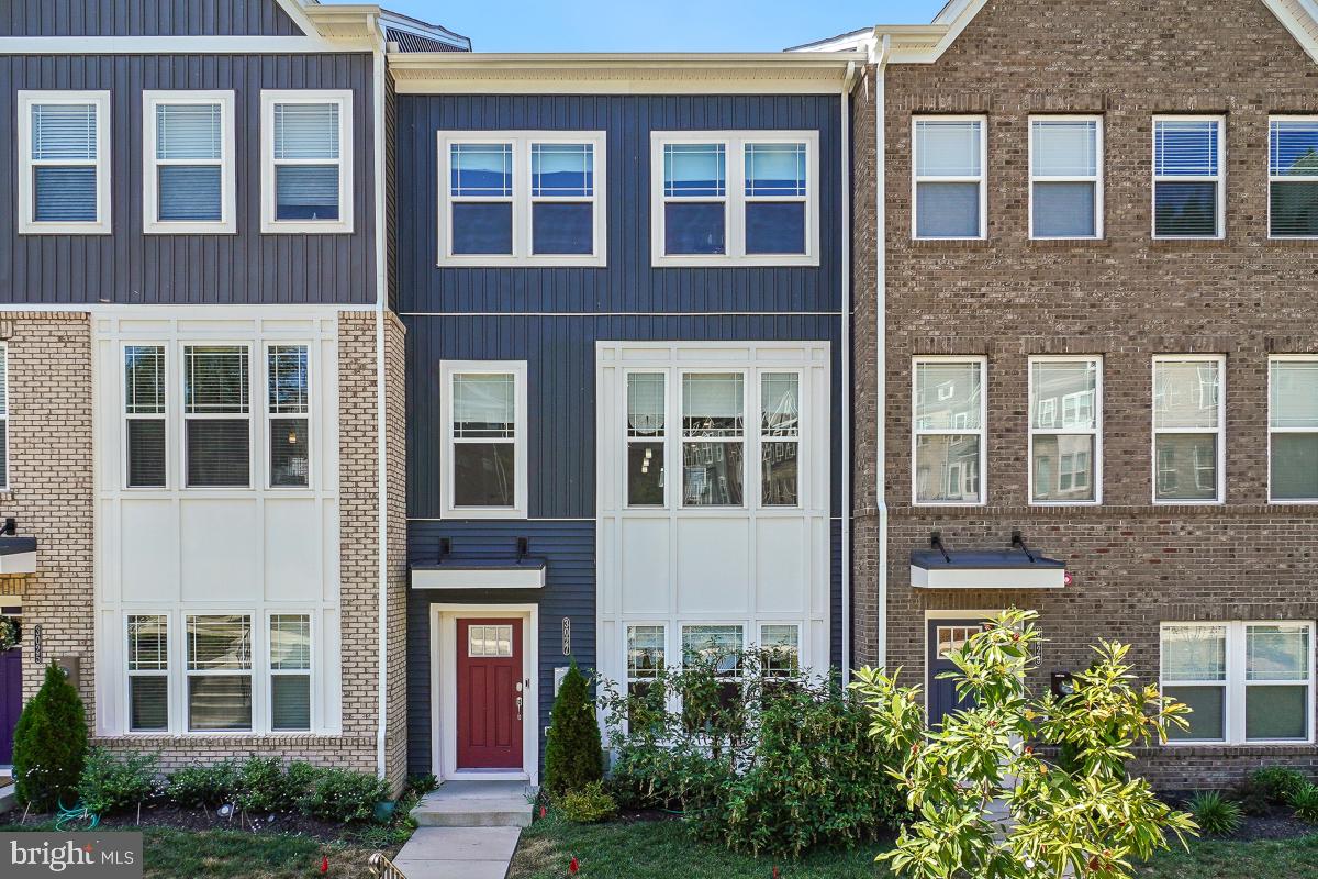 a front view of a building with a garden