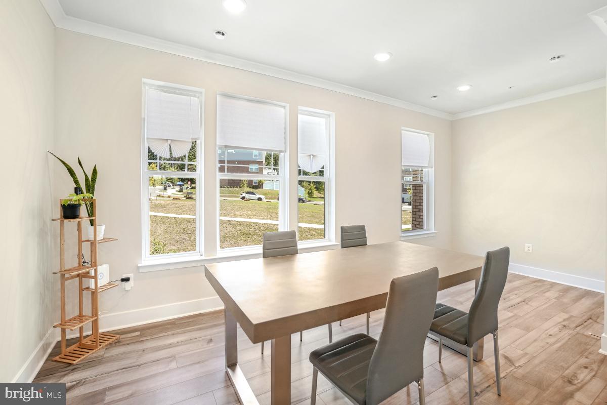 3027 Coriander Place Bryans Road, MD 20616 - Photo 17 of 29 a view of a dining room with furniture and a window
