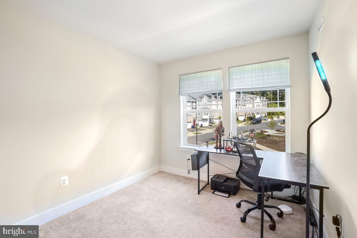 3027 Coriander Place Bryans Road, MD 20616 - Photo 27 of 29 a view of a workspace with furniture and a window