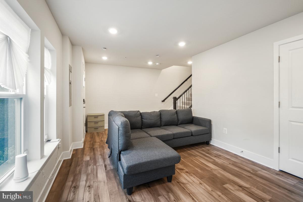 3027 Coriander Place Bryans Road, MD 20616 - Photo 5 of 29 a living room with furniture and a wooden floor