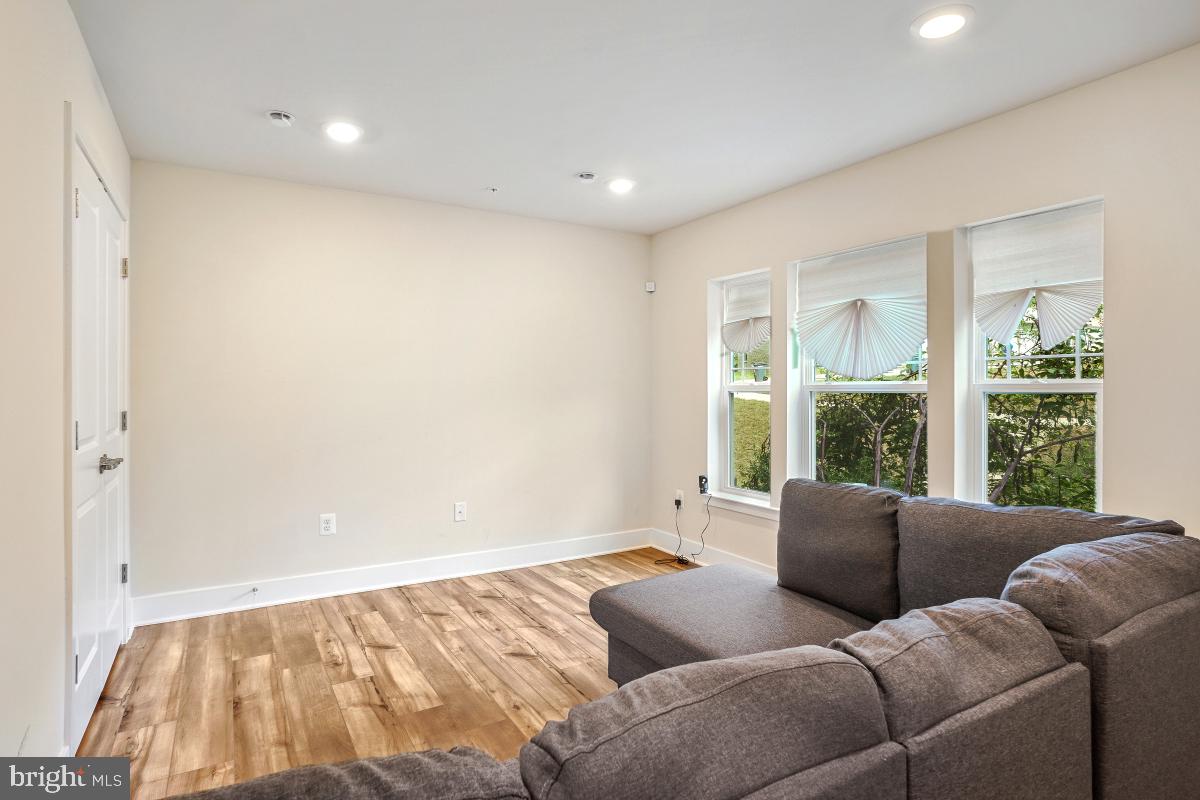 3027 Coriander Place Bryans Road, MD 20616 - Photo 7 of 29 a living room with furniture and a large window