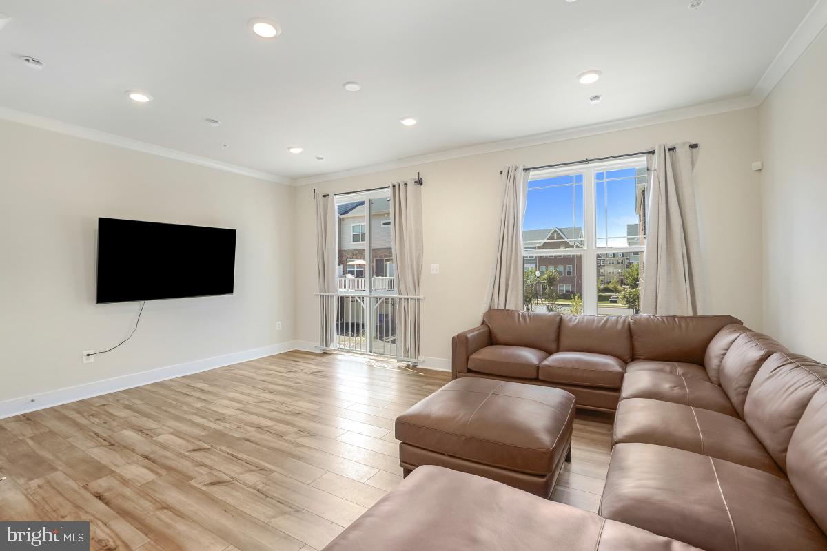 3027 Coriander Place Bryans Road, MD 20616 - Photo 9 of 29 a living room with furniture and a flat screen tv
