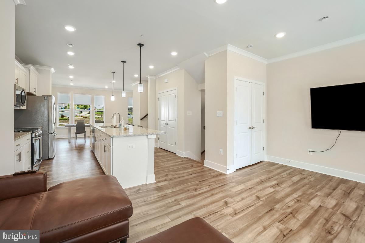 3027 Coriander Place Bryans Road, MD 20616 - Photo 10 of 29 a living room with stainless steel appliances furniture and a flat screen tv