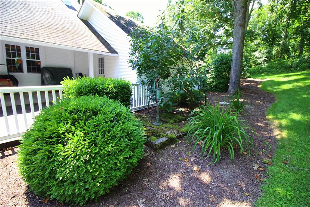 163 Sugar Run Road Eighty Four, PA 15330 - Photo 19 of 25 Rear yard landscaping around decking and garage.