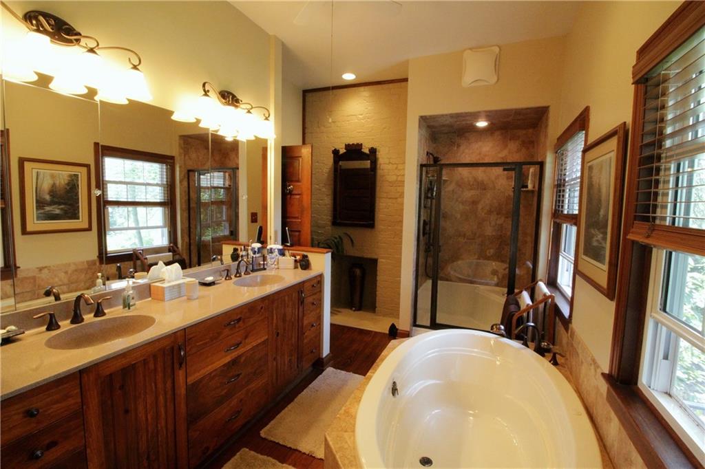 163 Sugar Run Road Eighty Four, PA 15330 - Photo 10 of 25 Newer master bath with double sinks, separate tub and shower, and a brick fireplace. (2009)