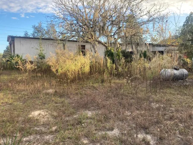 a backyard of a house with lots of green space